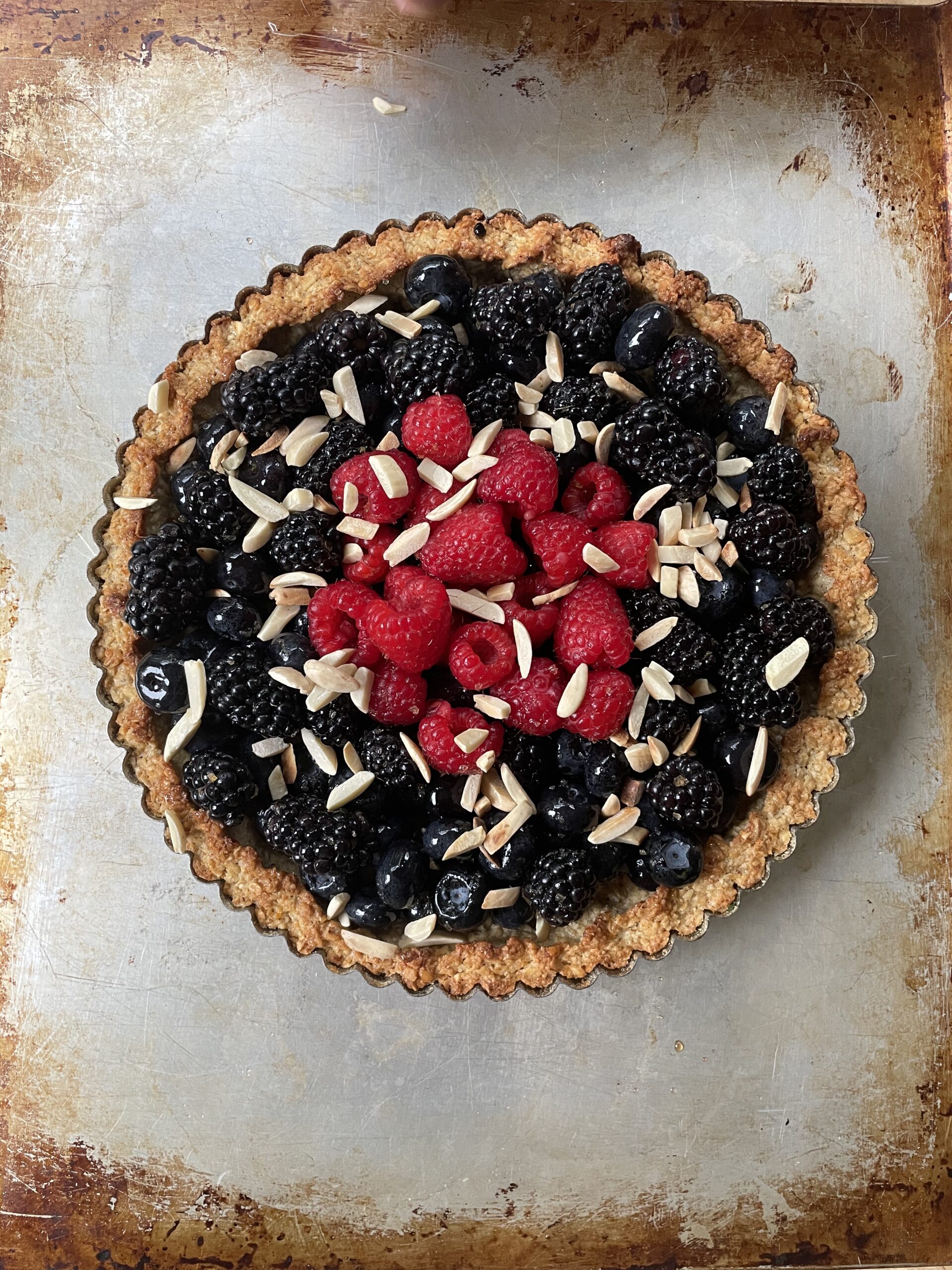 Berry tart topped with almonds